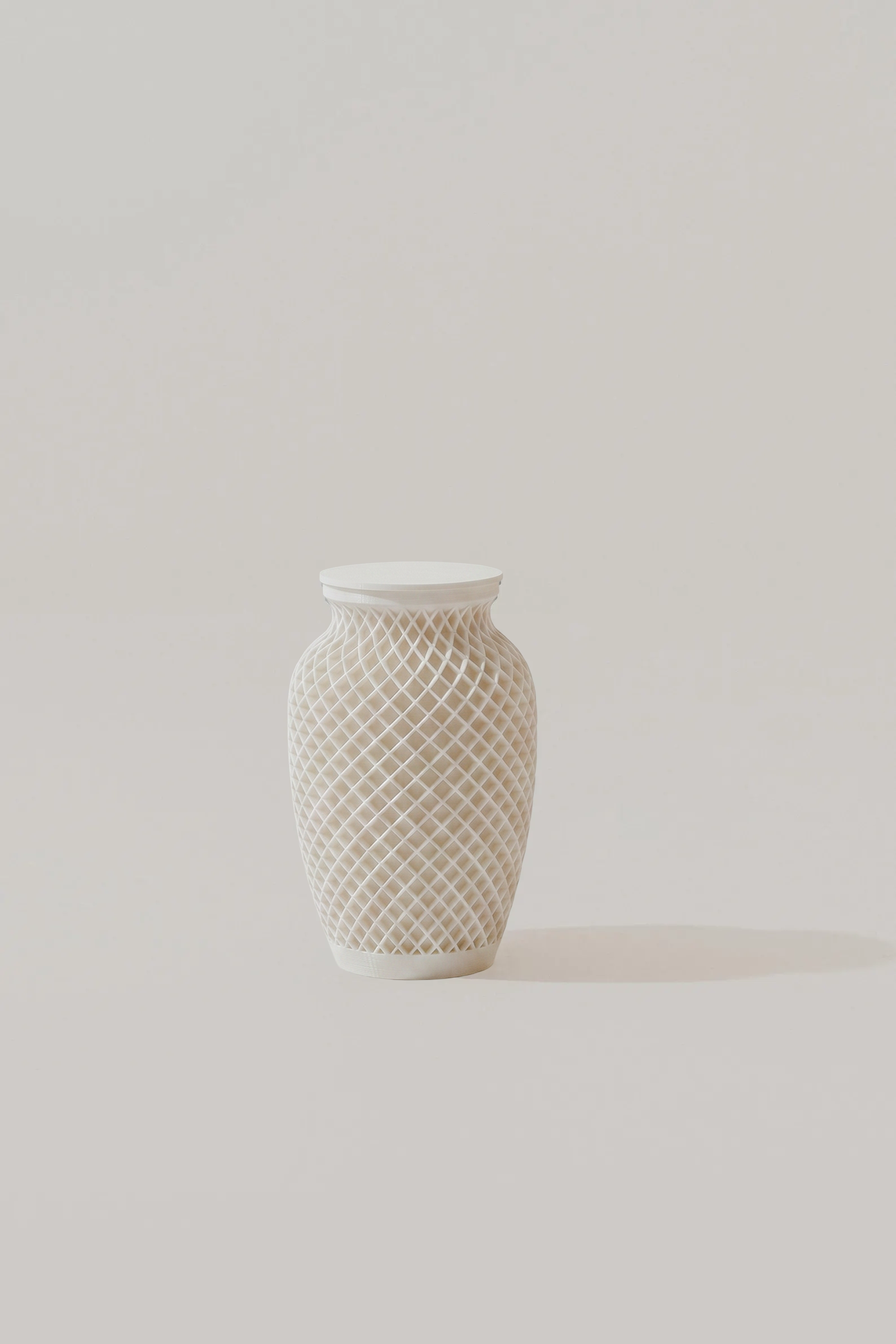 White textured memorial urn on a light gray background