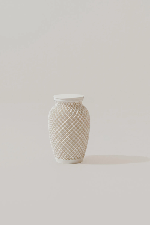 White textured memorial urn on a light gray background