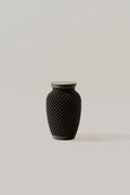 Black textured memorial urn on a light gray background