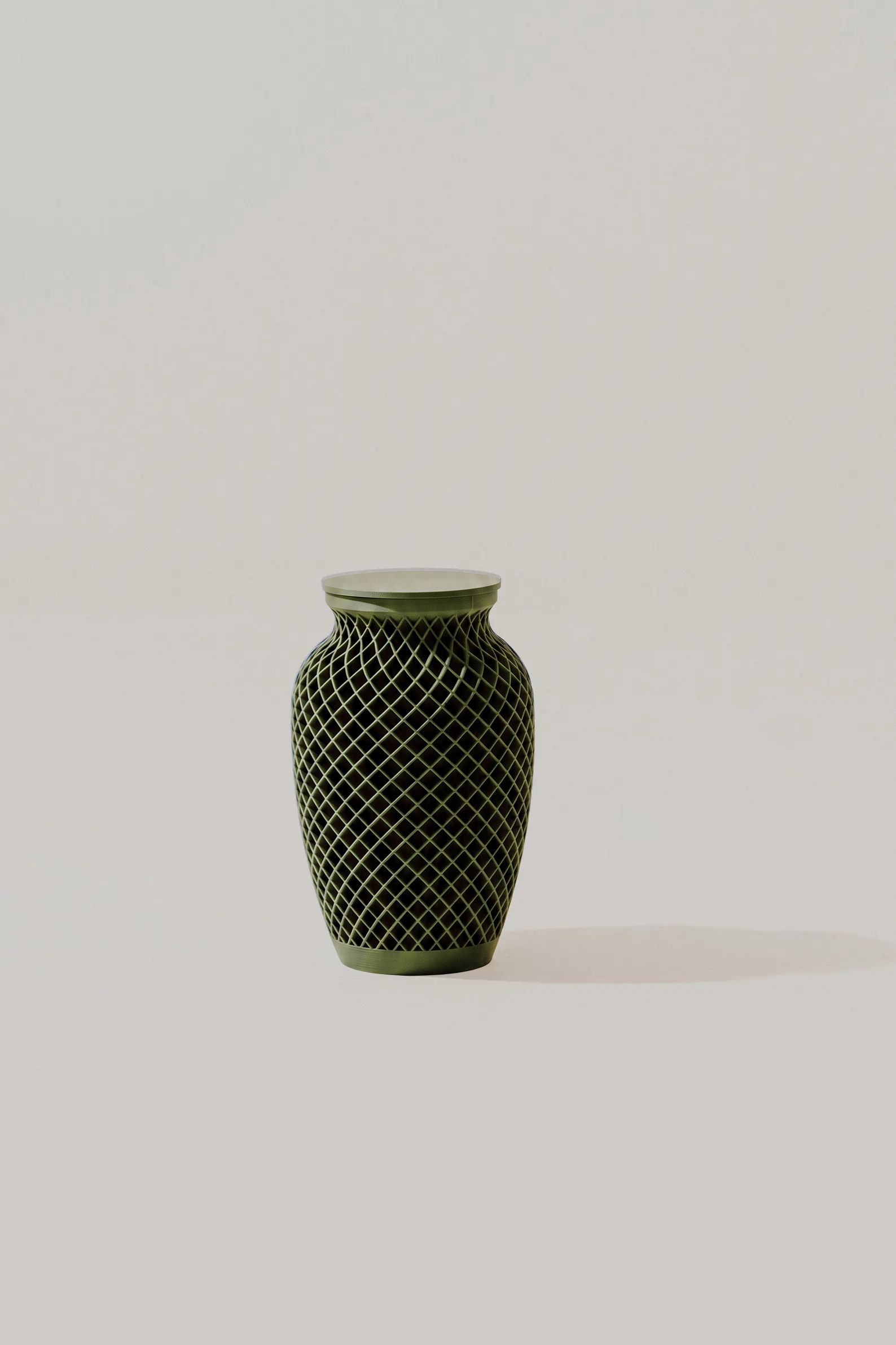 Green woven texture memorial urn with geometric pattern on a light background